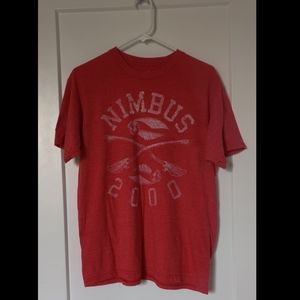 A red top with a quidditch print on it!